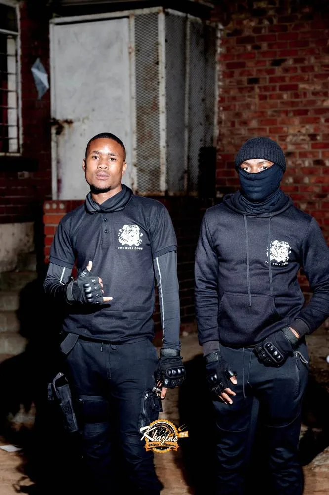 Two Bull Dogs officers in uniform and gloves