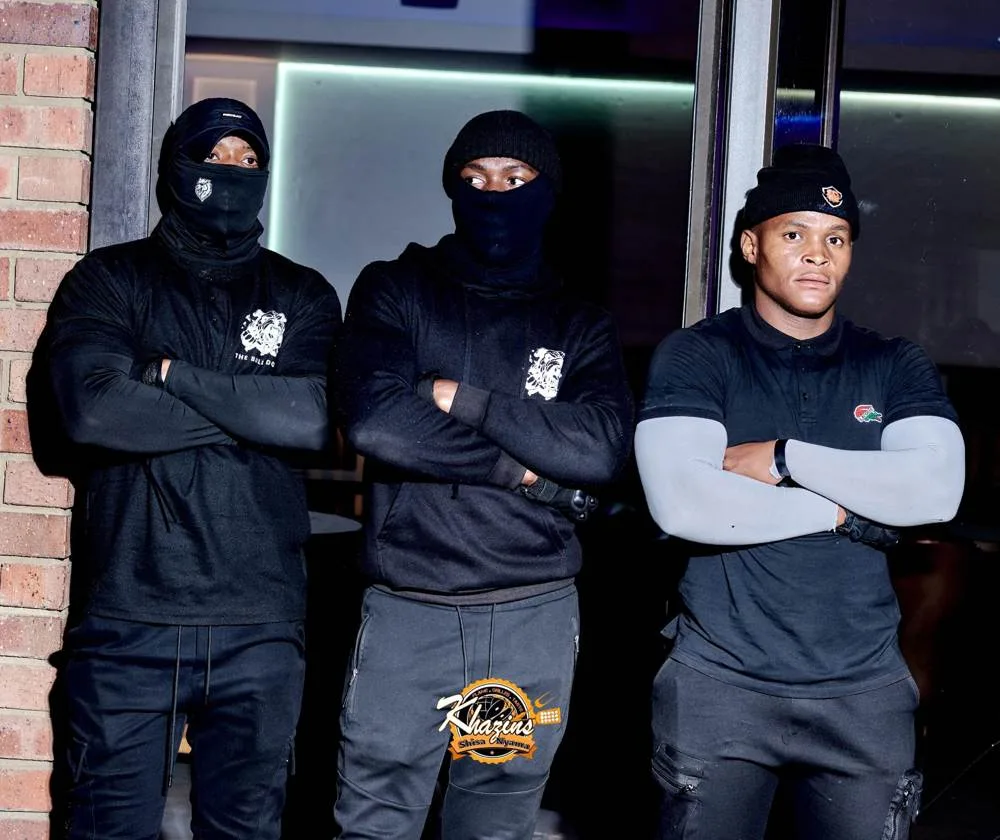 Three officers guarding a lounge entrance